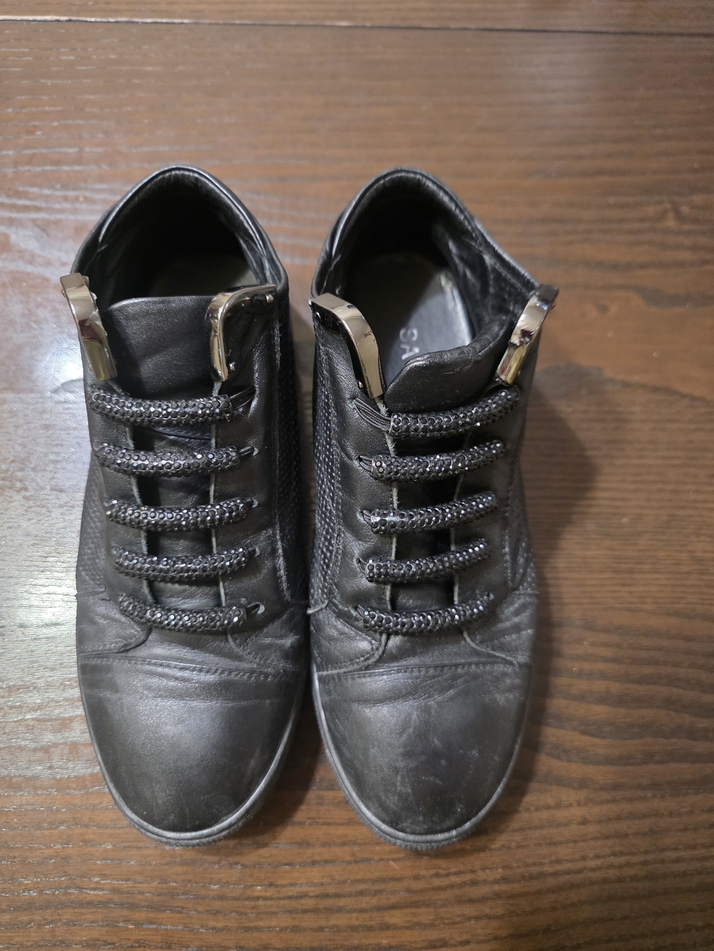 Women's Black Leather Slip-On Sneakers with Metallic Accent